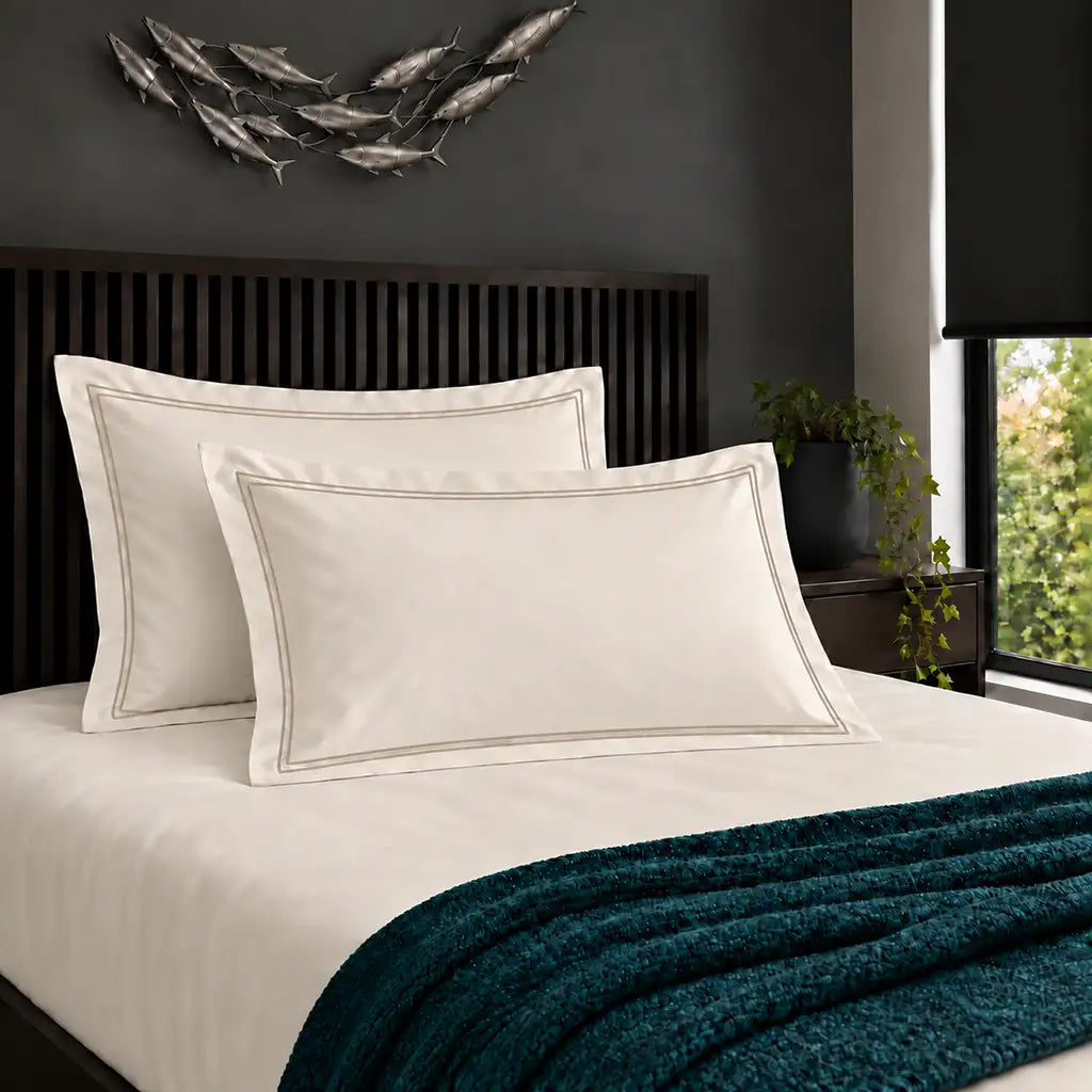 Oxford cream 200TC cotton percale pillowcases with two row stone satin stitch border by Linen and Co