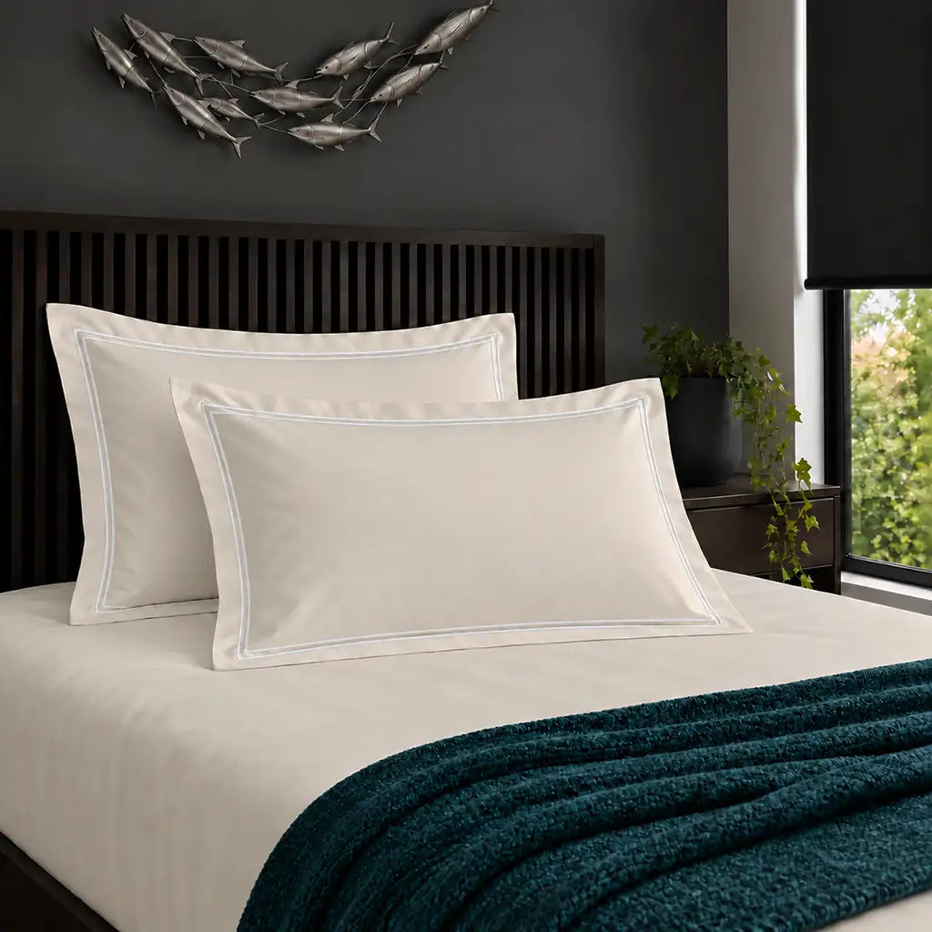 Oxford cream 200TC cotton percale pillowcases with two row white satin stitch border by Linen and Co