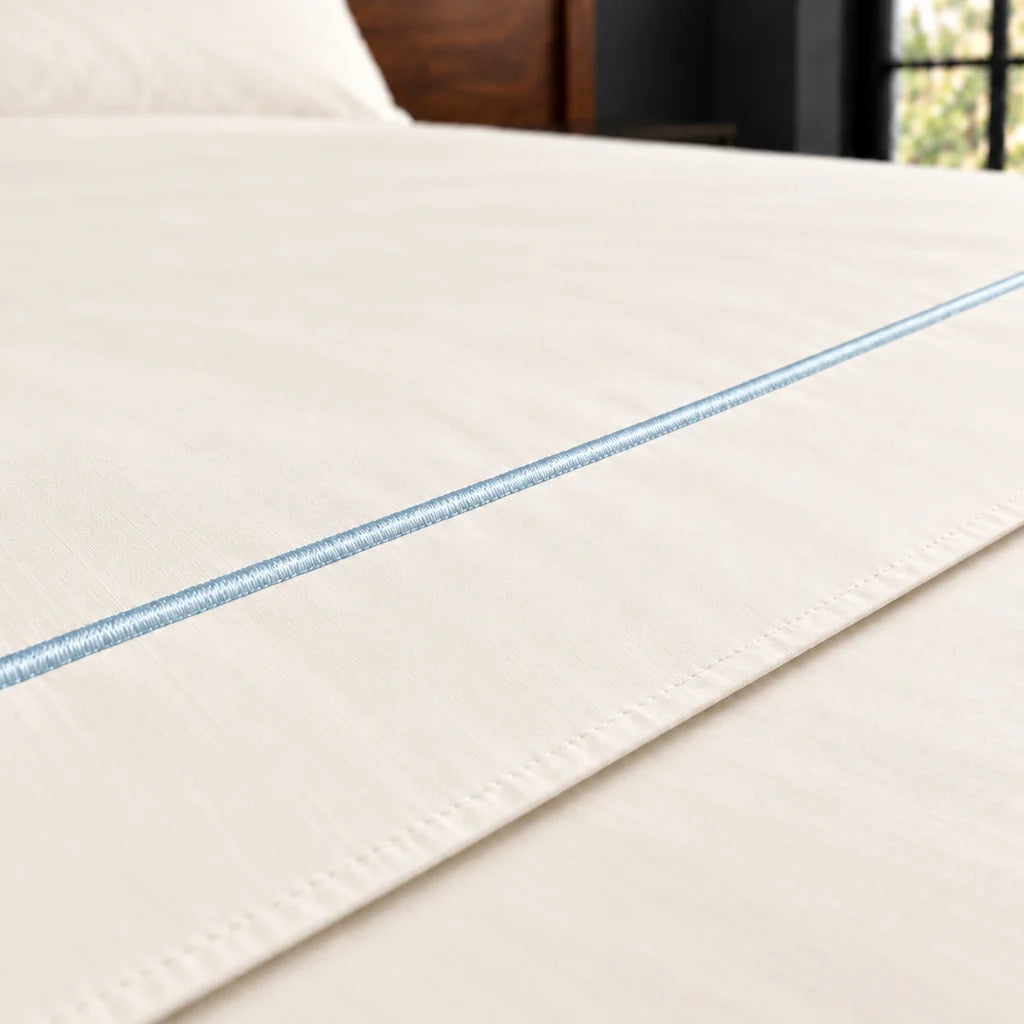 cream polycotton percale 200tc flat sheet, one row duck egg satin stitch — close up — Linen and Co