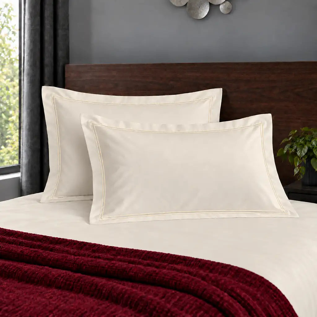Oxford cream 200TC polycotton percale pillowcases with two row cream satin stitch border by Linen and Co