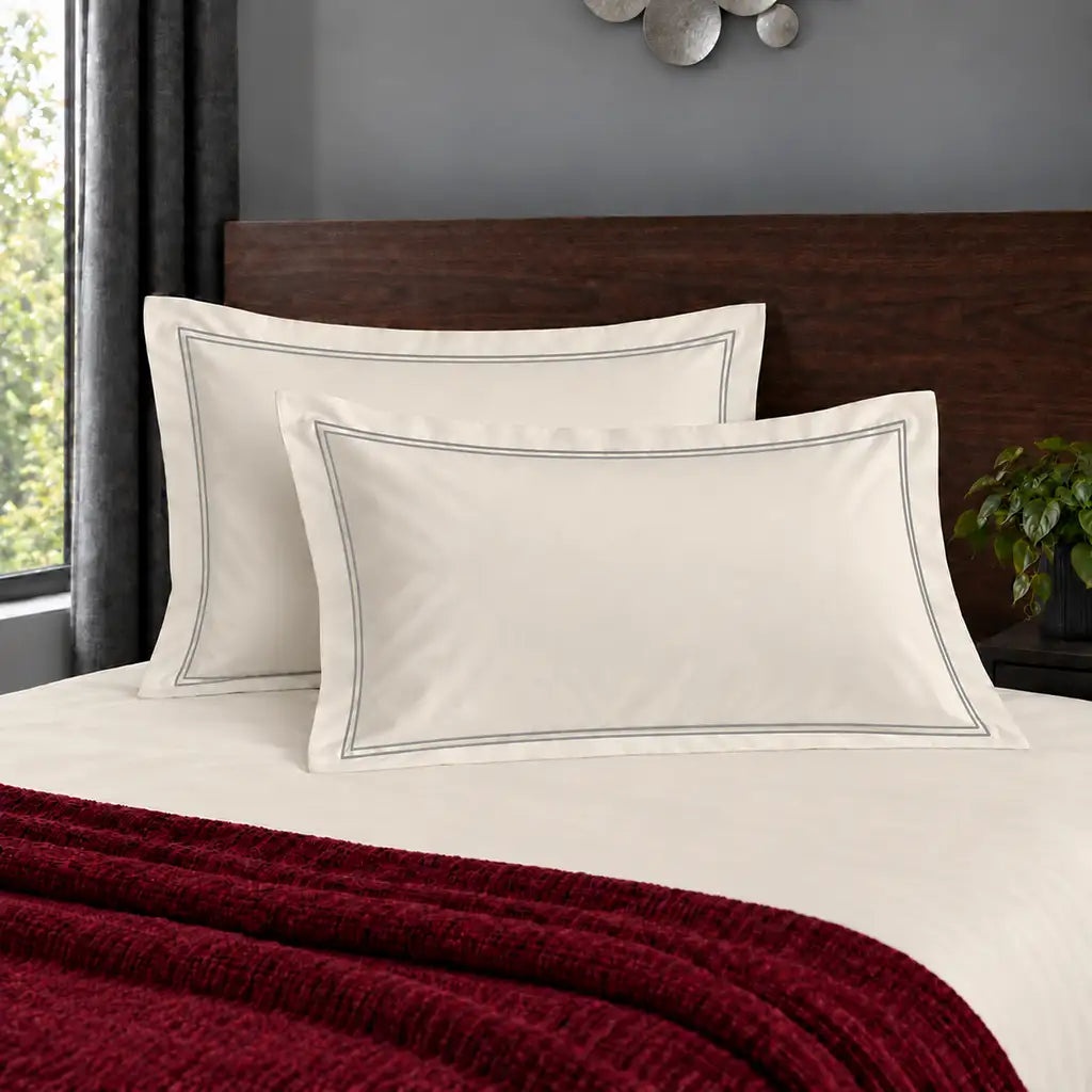 Oxford cream 200TC polycotton percale pillowcases with two row grey satin stitch border by Linen and Co