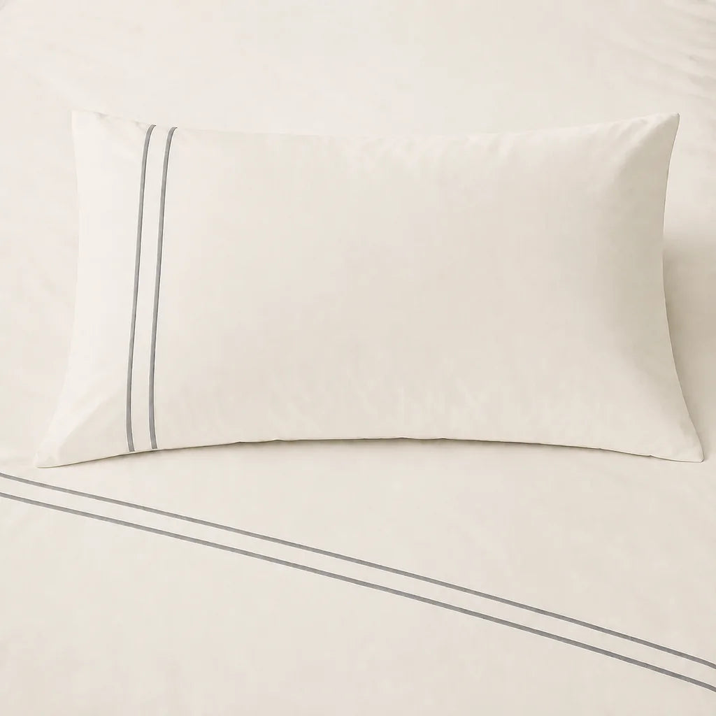 Cream 200TC cotton percale plain duvet cover set with Grey two row satin stitch - on the bed - Linen and Co