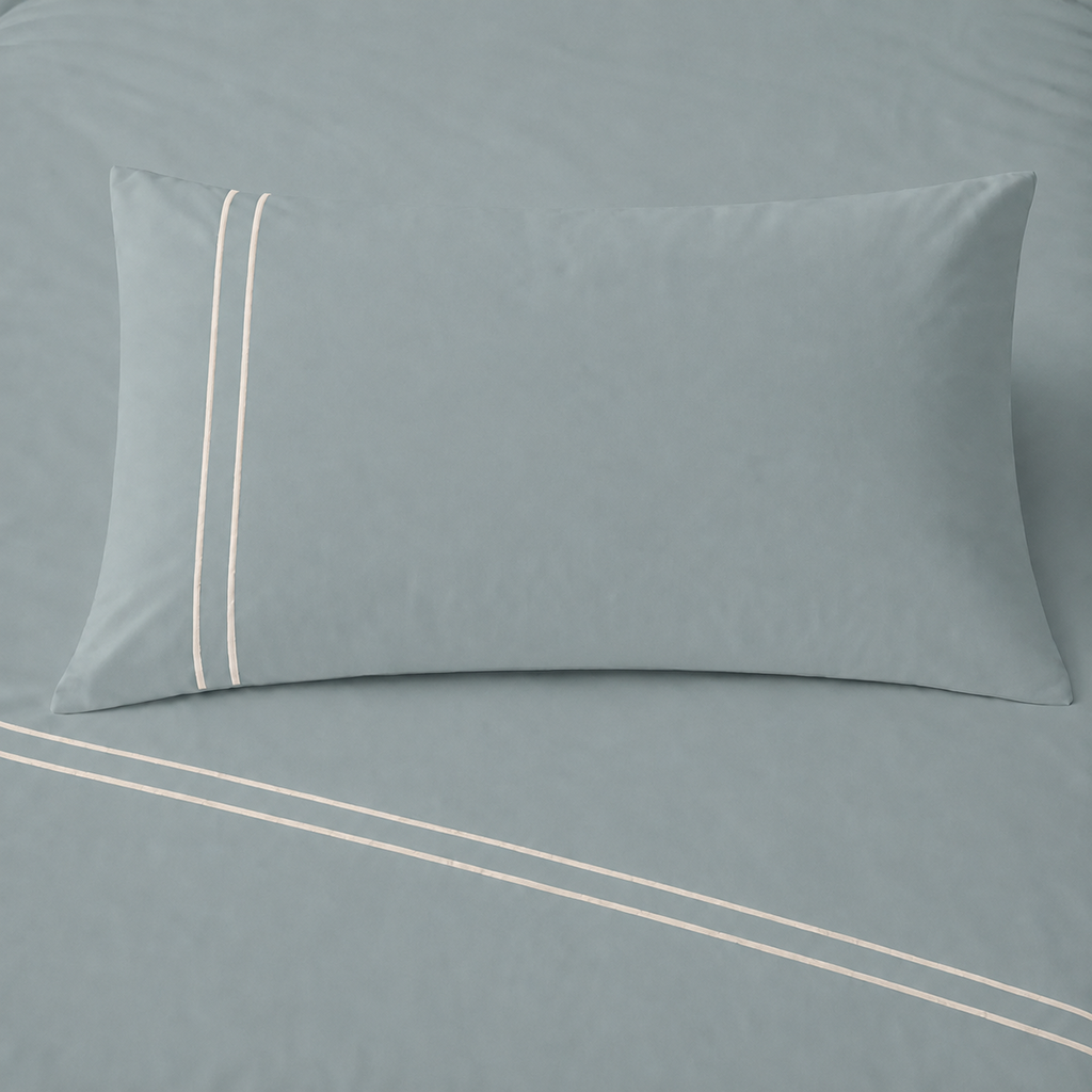 Duck Egg 200TC cotton percale plain duvet cover set with Cream two row satin stitch - pillow on bed - Linen and Co