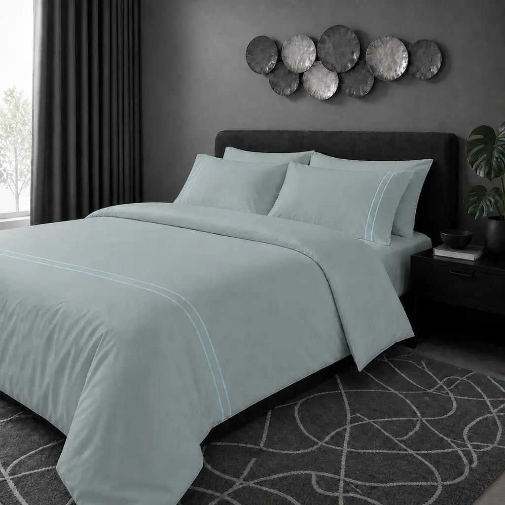 Duck Egg 200TC cotton percale plain duvet cover set with Duck Egg two row satin stitch - pillow on bed - Linen and Co