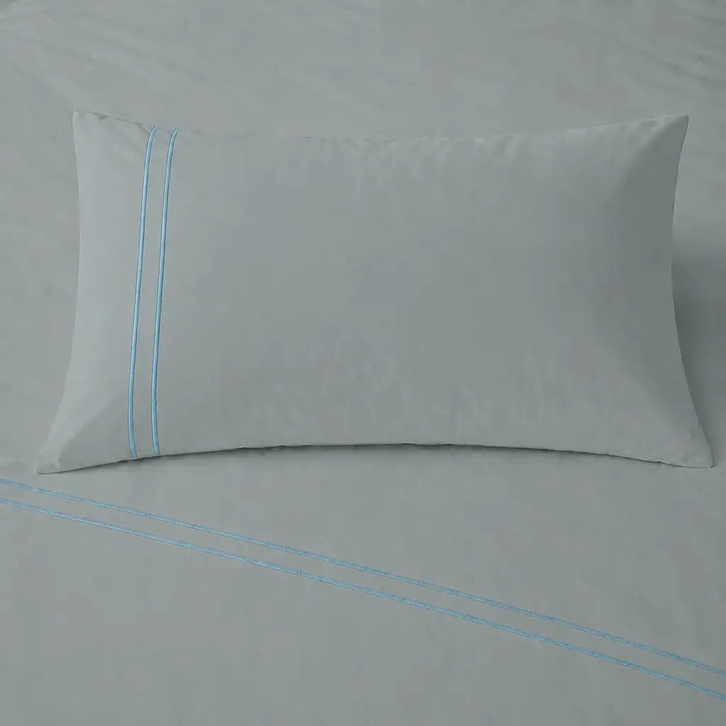 Duck Egg 200TC cotton percale plain duvet cover set with Duck Egg two row satin stitch - pillow on bed - Linen and Co
