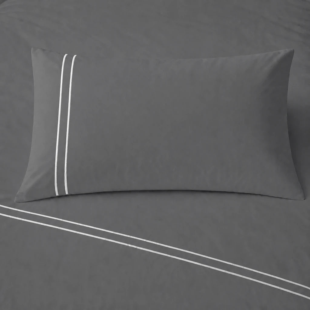 Grey 200TC cotton percale plain duvet cover set with Cream two row satin stitch - pillow on bed - Linen and Co