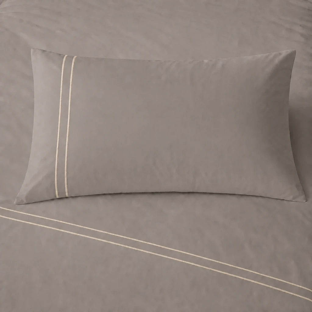 Stone 200TC cotton percale plain duvet cover set with Cream two row satin stitch - pillow on bed - Linen and Co
