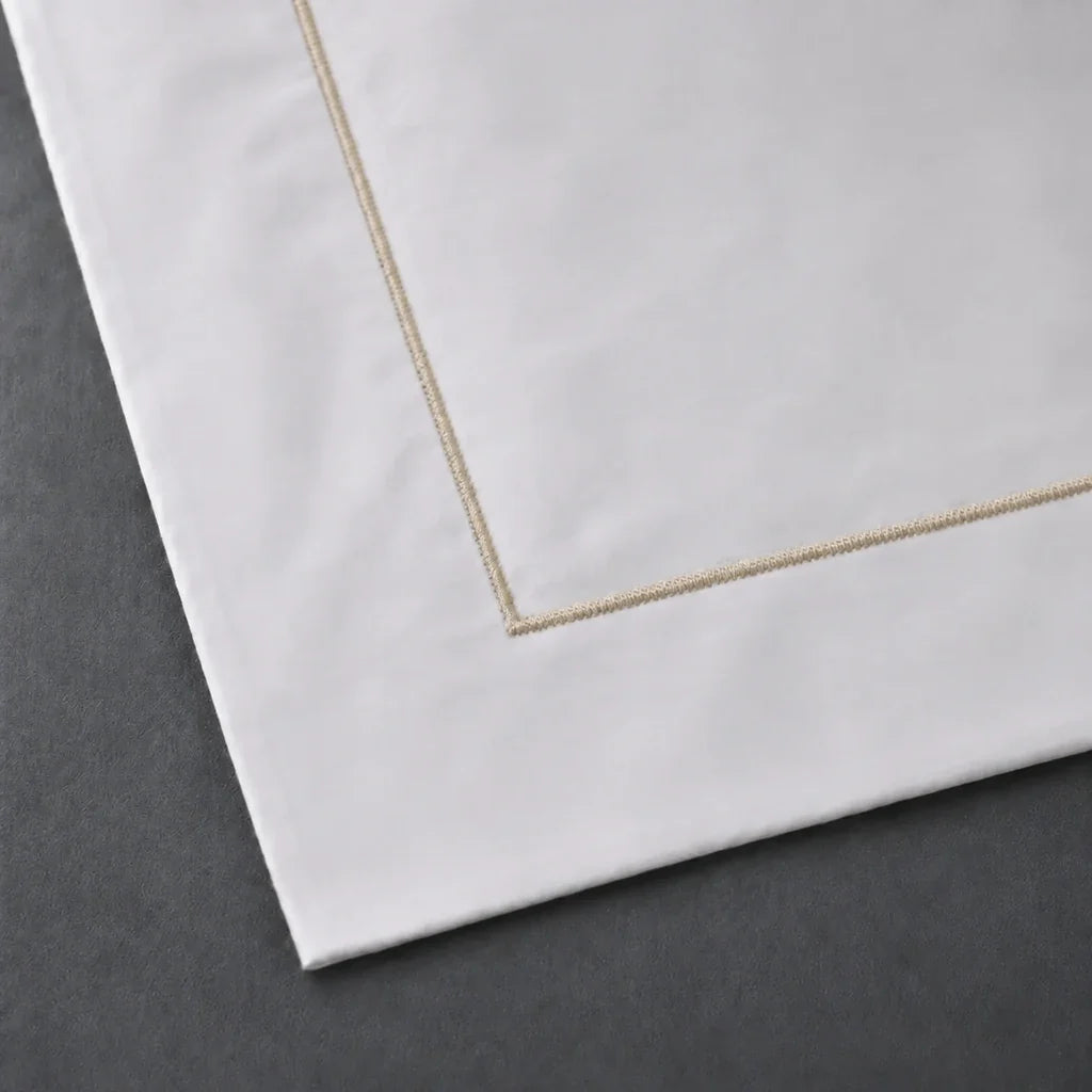 Close-up of a White 100% cotton percale 300TC Oxford pillow case with Stone one-row satin stitch.