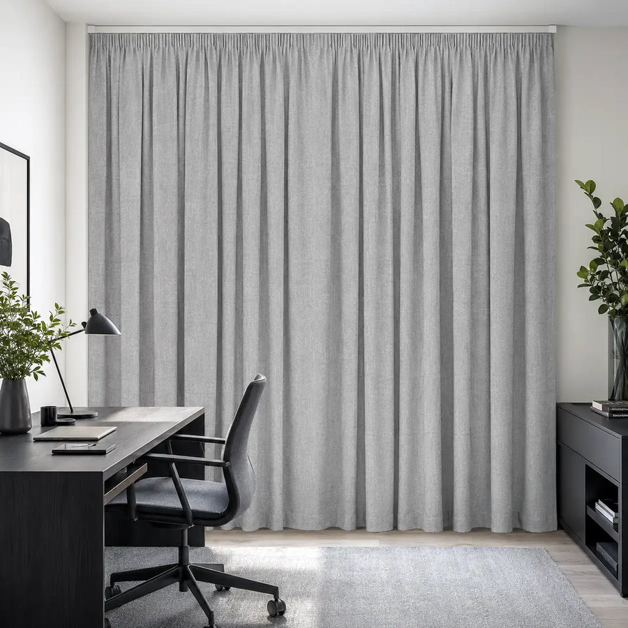 Cloud blockout curtains bring soft privacy and a clean tailored finish to a calm home office.