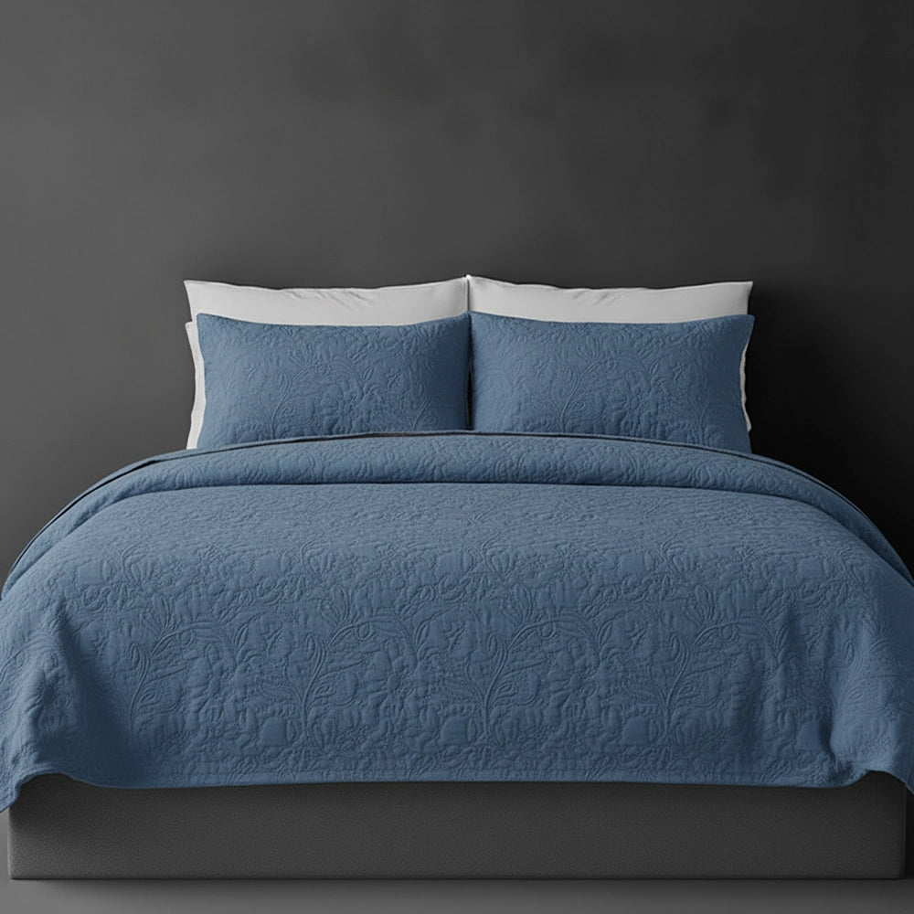 Denim Blue Carmen bedspread on bed by Linen and Co - luxury hospitality bedspread with textured finish