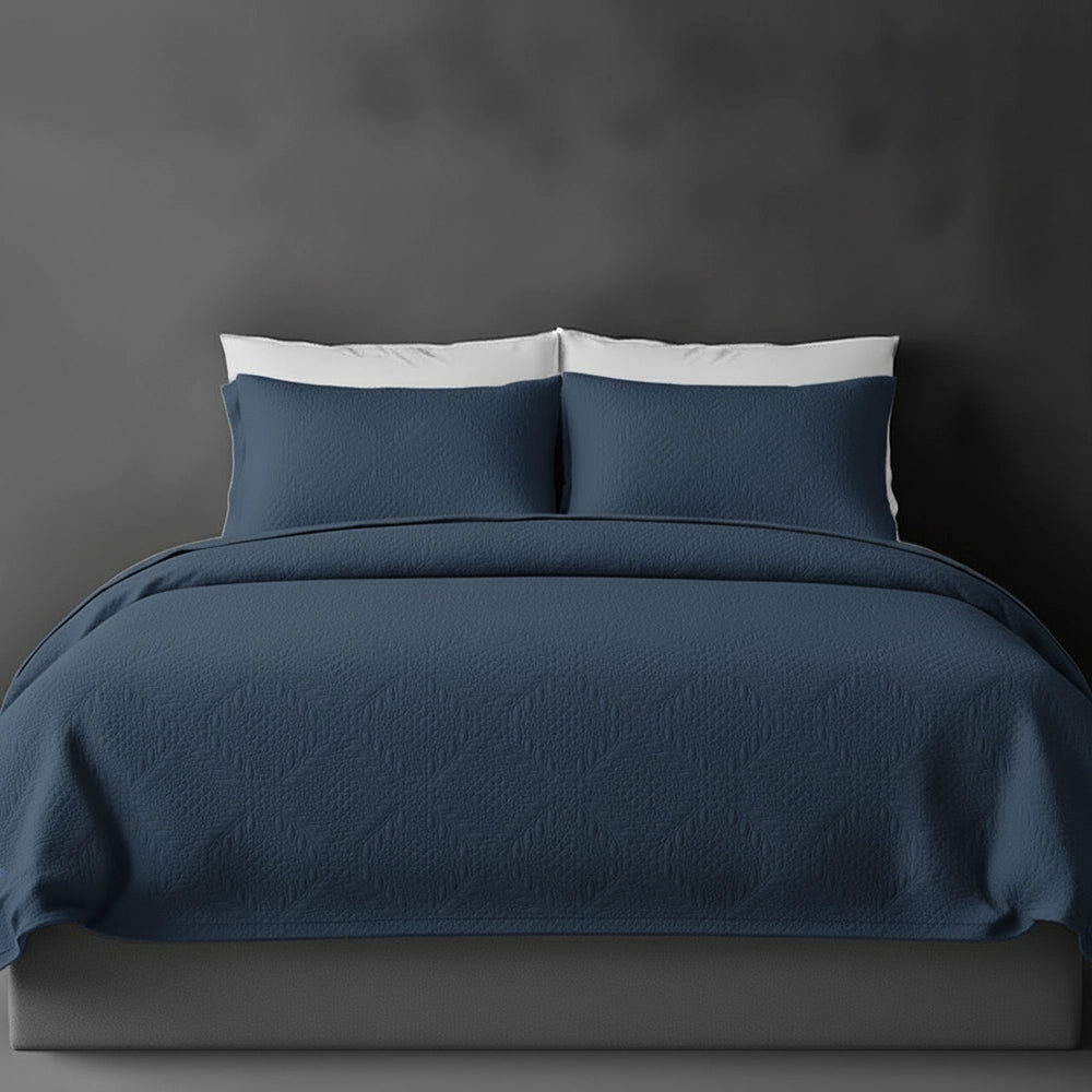 Denim Blue Istanbul bedspread on bed by Linen and Co - luxury hospitality bedspread with textured finish