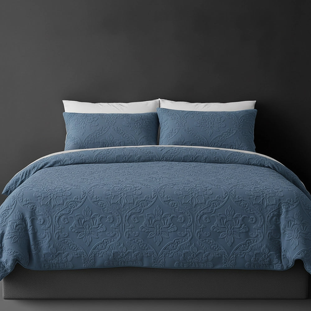 Denim Blue Melissa bedspread on bed by Linen and Co - luxury hospitality bedspread with textured finish