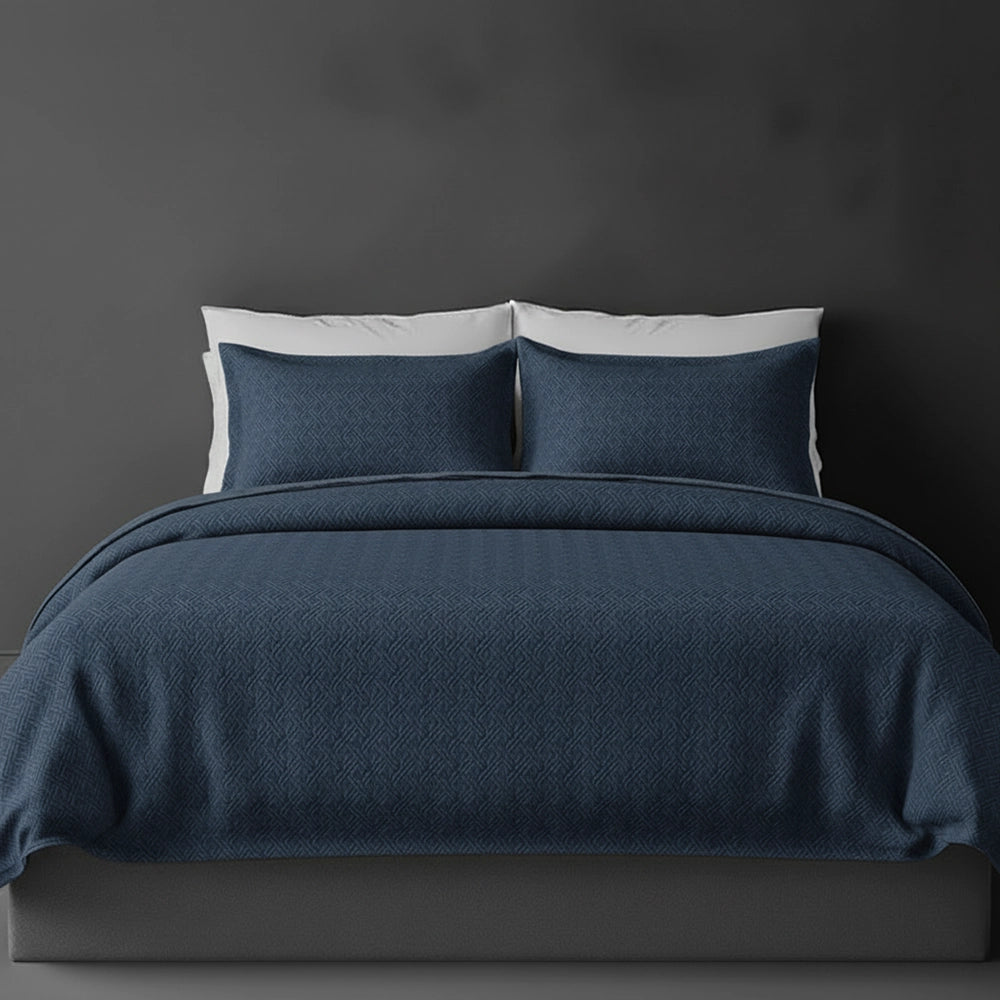 Denim Blue Rome bedspread on bed by Linen and Co - luxury hospitality bedspread with textured finish