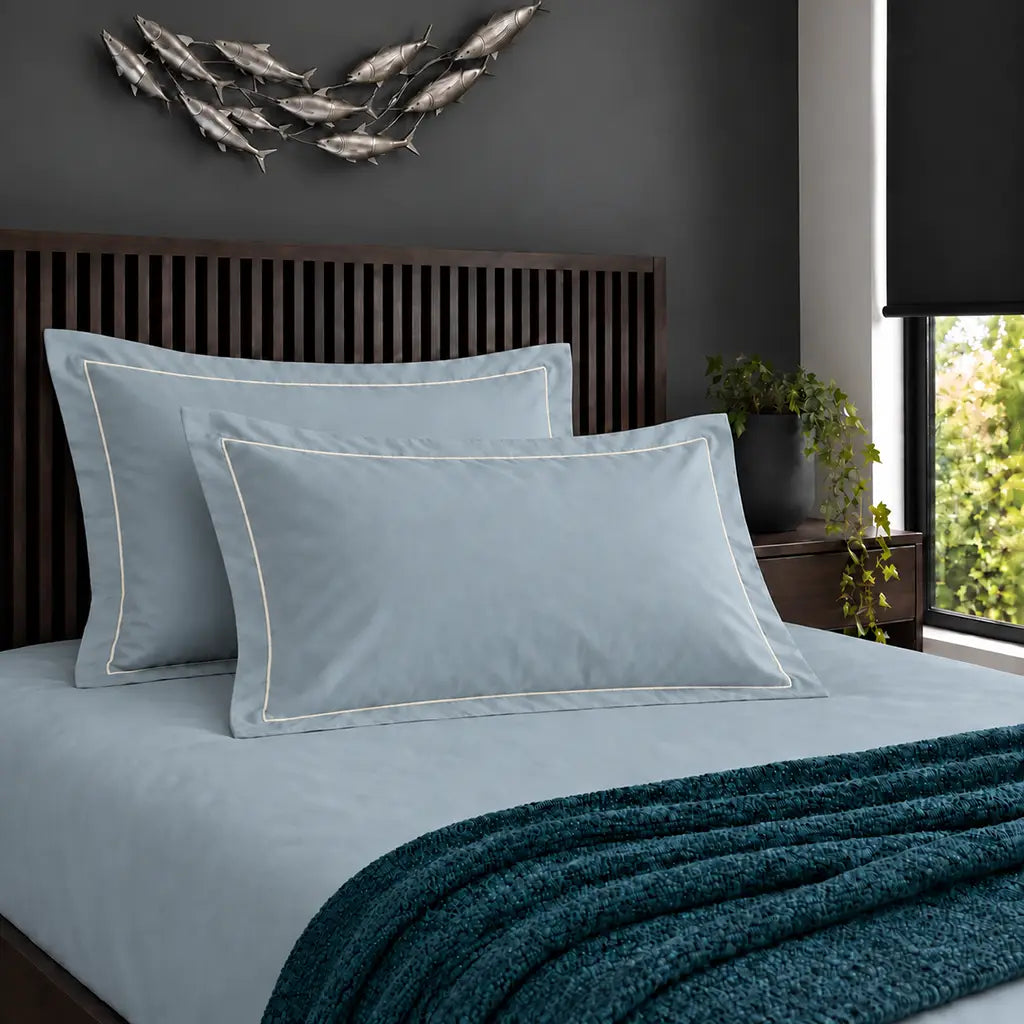 Oxford duck egg 200TC cotton percale pillowcases with one row cream satin stitch border by Linen and Co