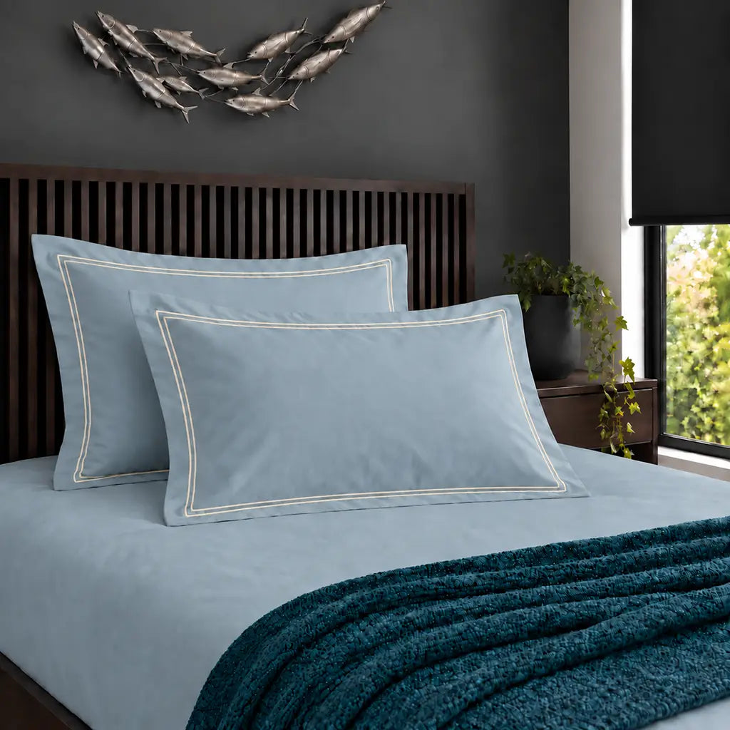 Oxford duck egg 200TC cotton percale pillowcases with two row cream satin stitch border by Linen and Co