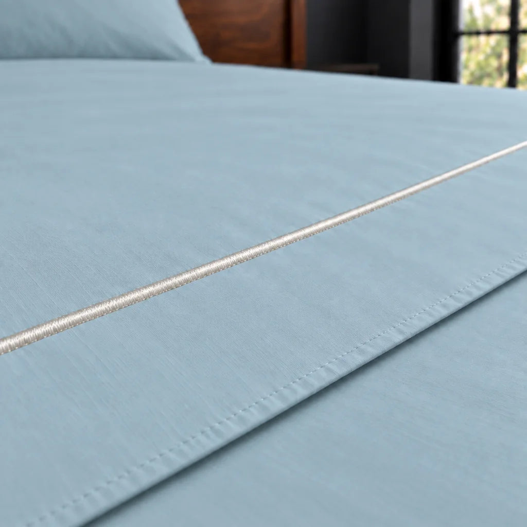 duck egg polycotton percale 200tc flat sheet, one row cream satin stitch — close up — Linen and Co