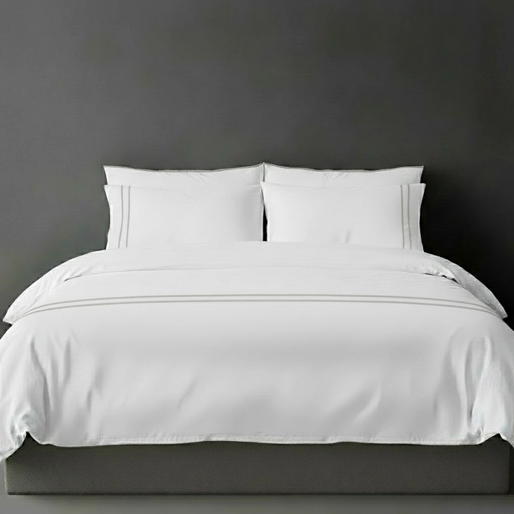 White duvet cover with grey satin stitch and pillows by Linen and Co - luxury bed linen