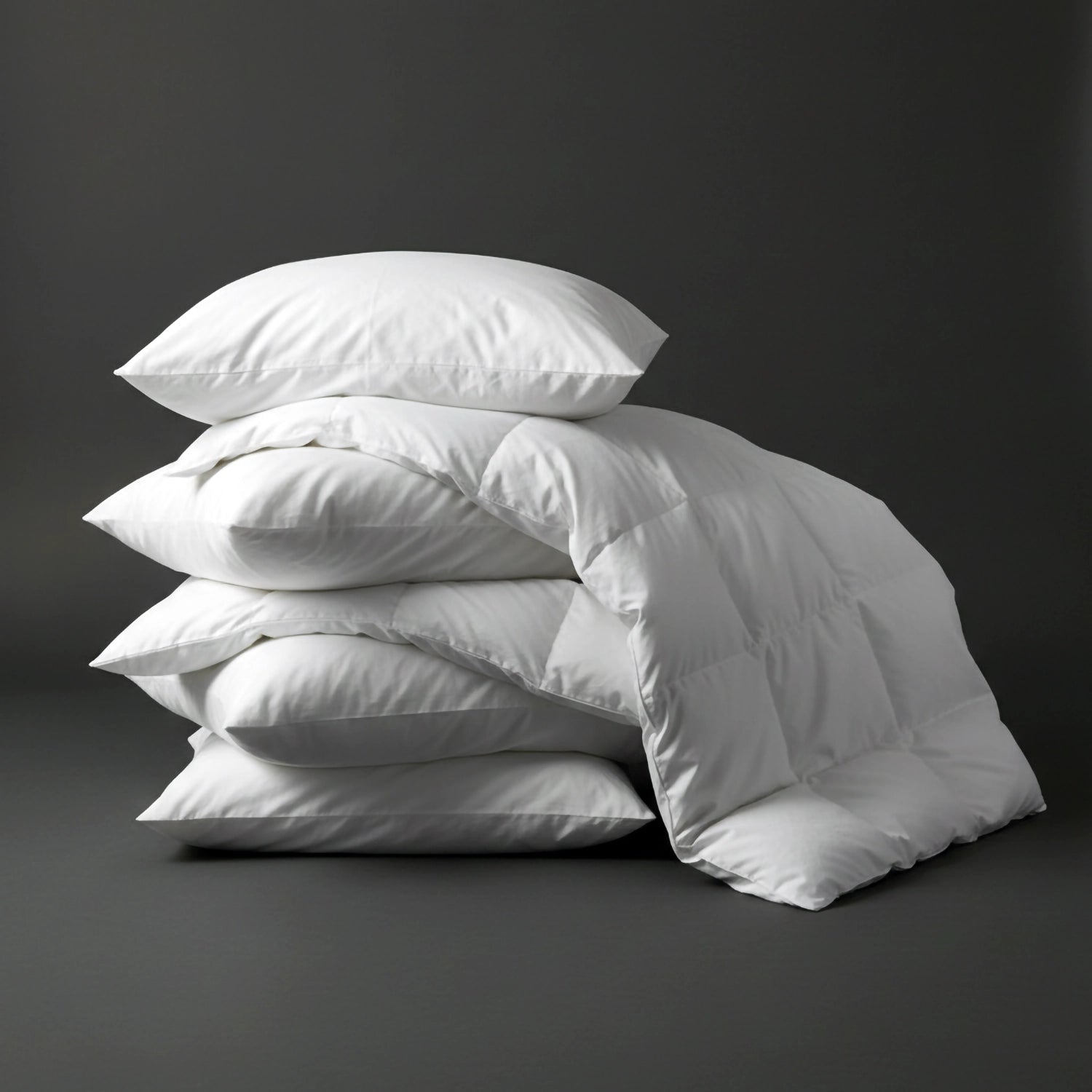 Quilted towelling pillow protectors by Linen and Co, stacked to showcase breathable, protective bedding for hospitality and home.