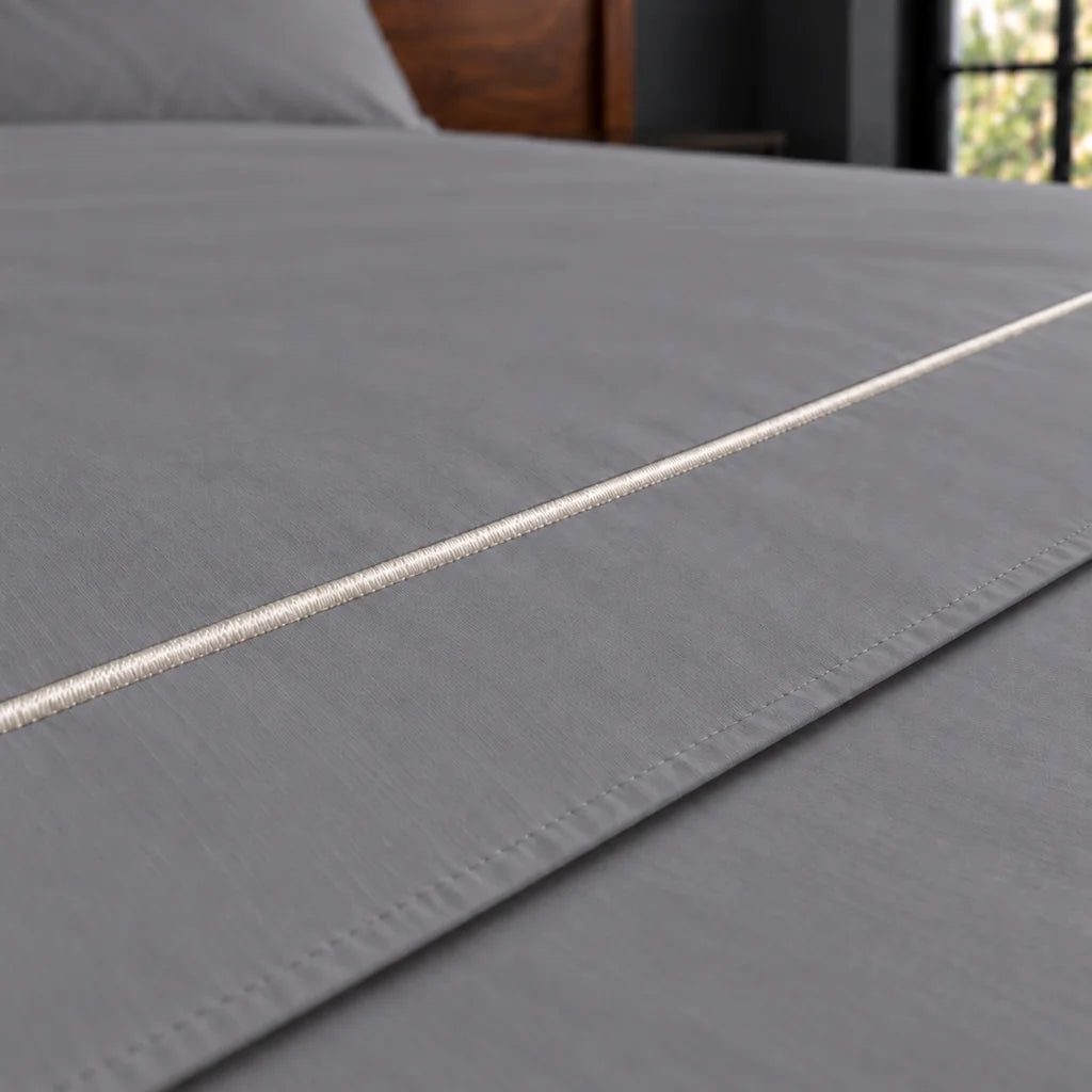 grey cotton percale 200tc flat sheet, one row cream satin stitch — close up — Linen and Co