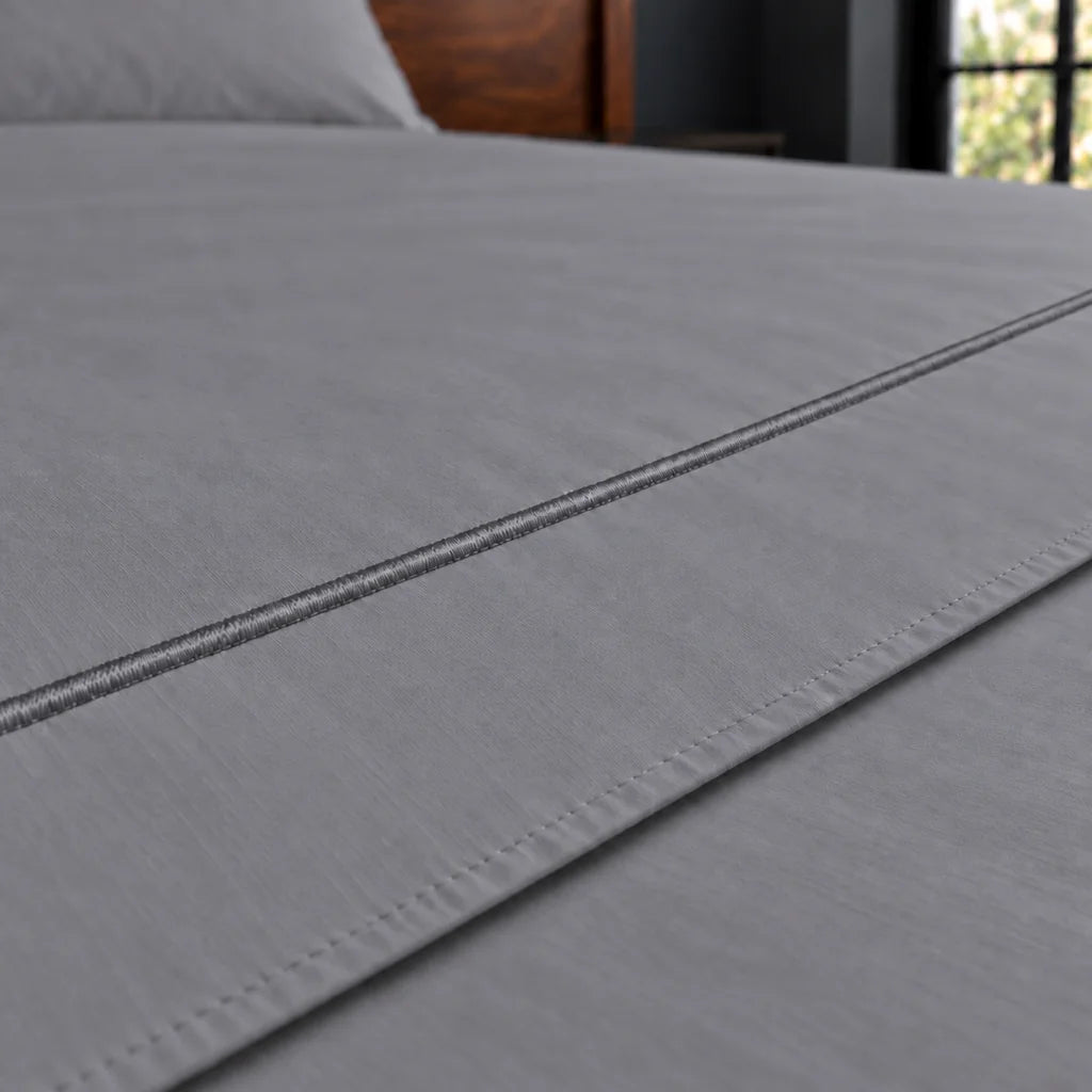 grey cotton percale 200tc flat sheet, one row grey satin stitch — close up — Linen and Co