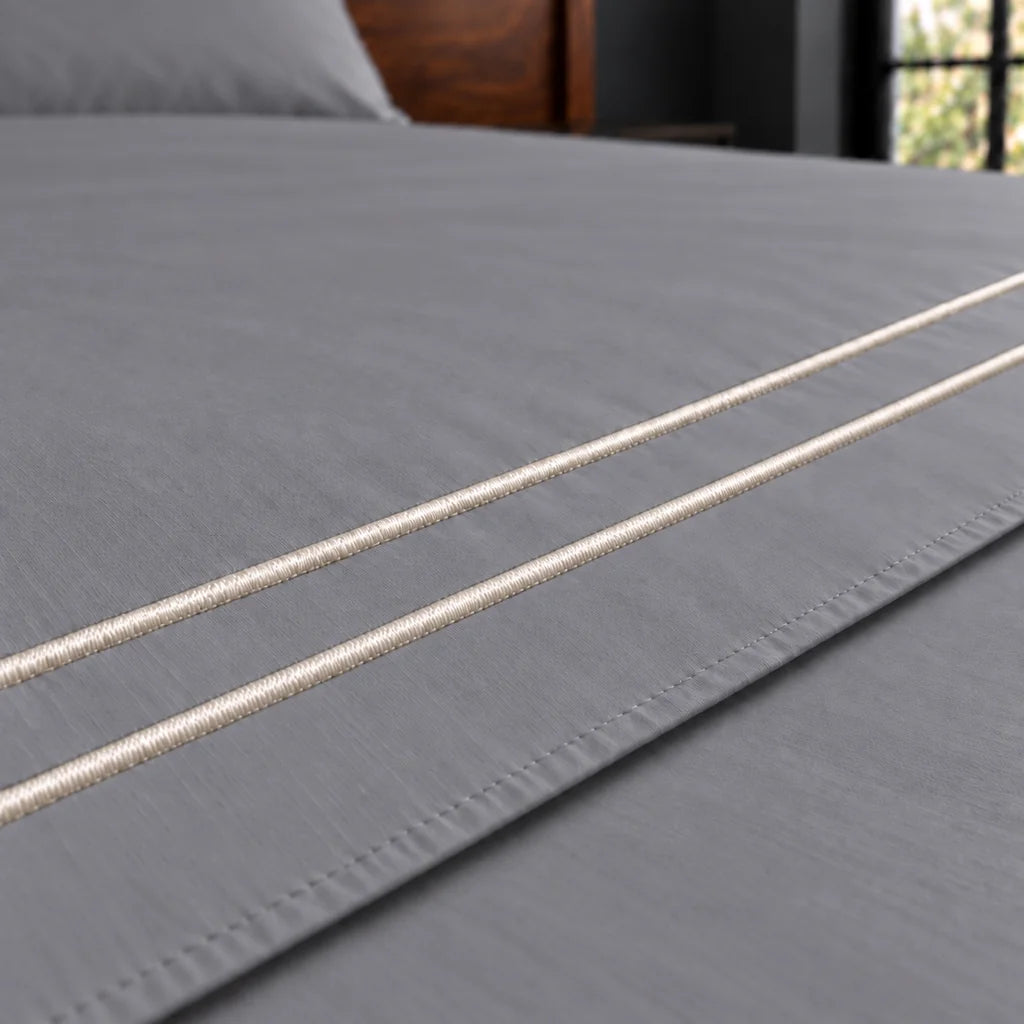 grey cotton percale 200tc flat sheet, two row cream satin stitch — close up — Linen and Co
