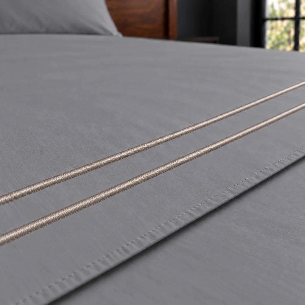 grey cotton percale 200tc flat sheet, two row stone satin stitch — close up — Linen and Co
