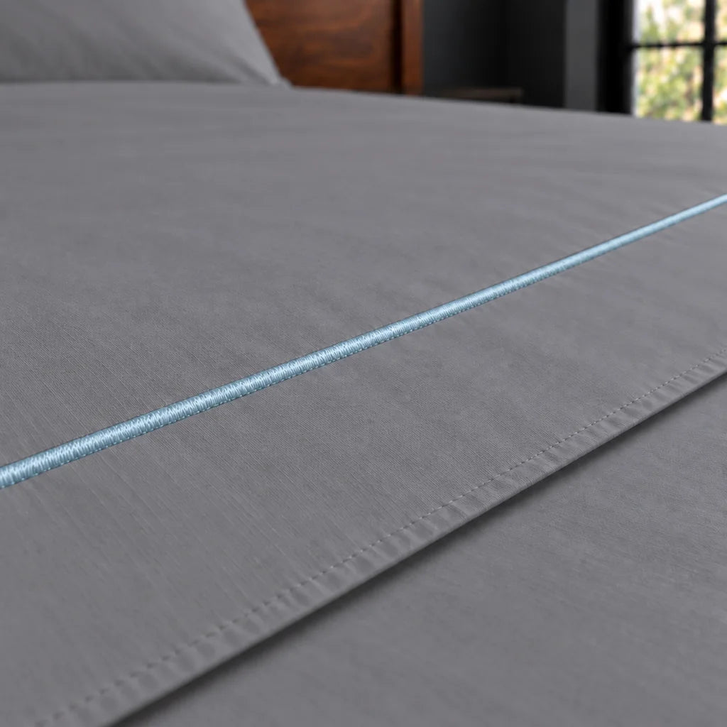 grey polycotton percale 200tc flat sheet, one row duck egg satin stitch — close up — Linen and Co