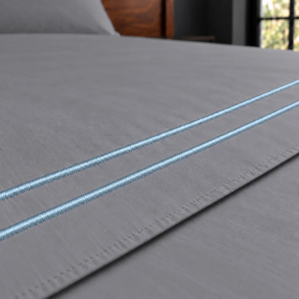 grey polycotton percale 200tc flat sheet, two row duck egg satin stitch — close up — Linen and Co