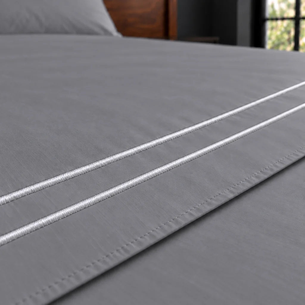 grey polycotton percale 200tc flat sheet, two row white satin stitch — close up — Linen and Co