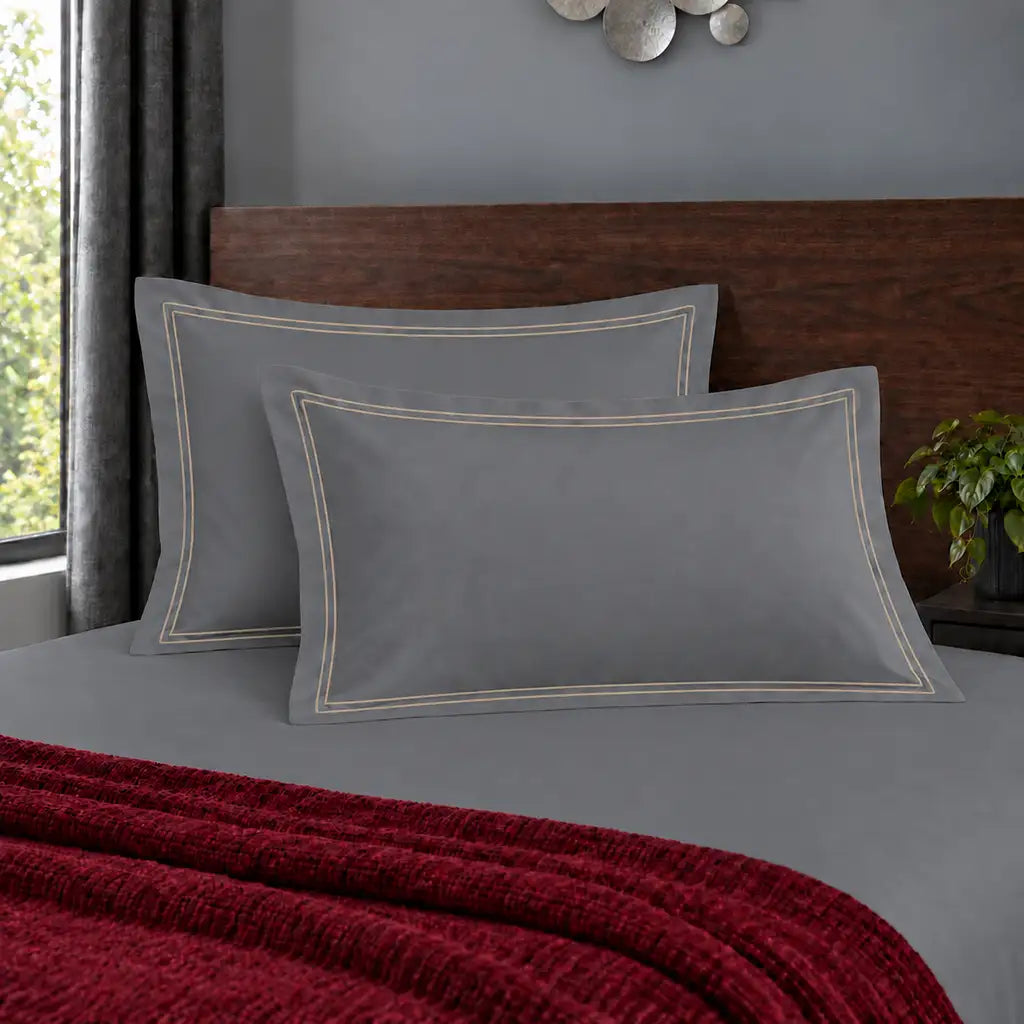 Oxford grey 200TC polycotton percale pillowcases with two row grey satin stitch border by Linen and Co