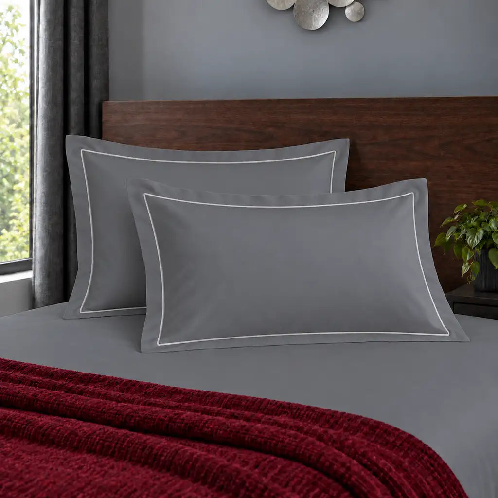 Oxford grey 200TC polycotton percale pillowcases with one row white satin stitch border by Linen and Co