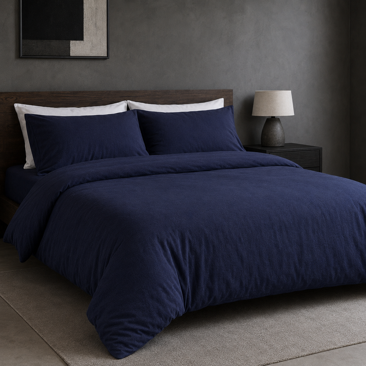Navy cotton jersey duvet cover set styled on a bed
