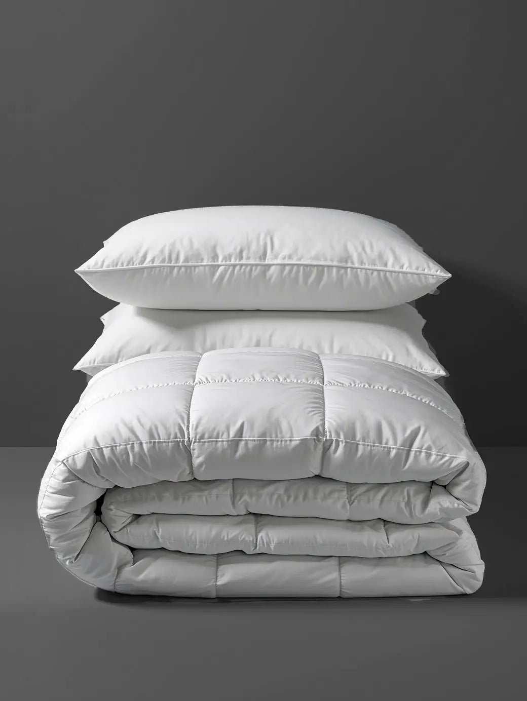 White duvet inner and pillows in a studio arrangement