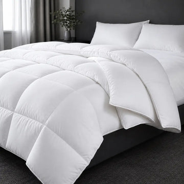 Luxury white microfibre duvet inner styled on a cool grey hotel bed – Linen & Co