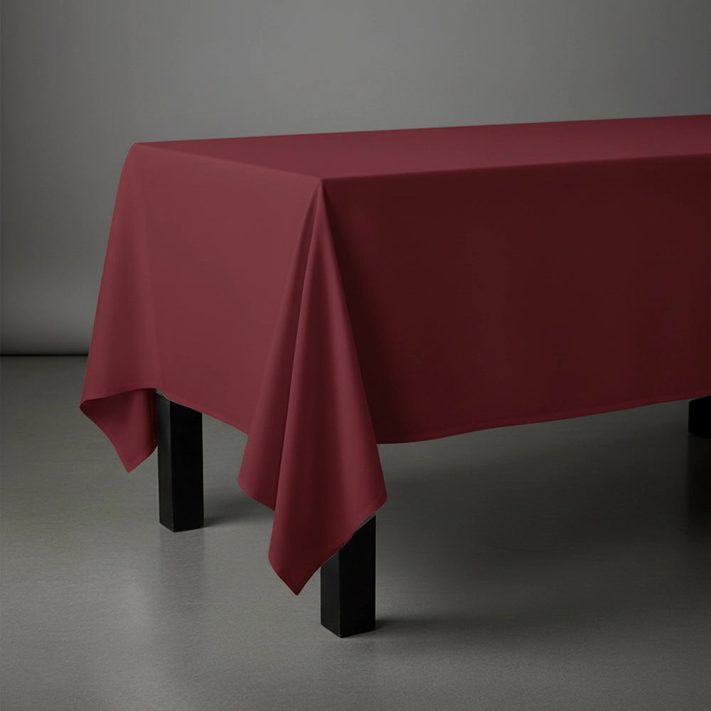 Maroon rectangle table cloth on wooden table by Linen and Co - premium hospitality table linen