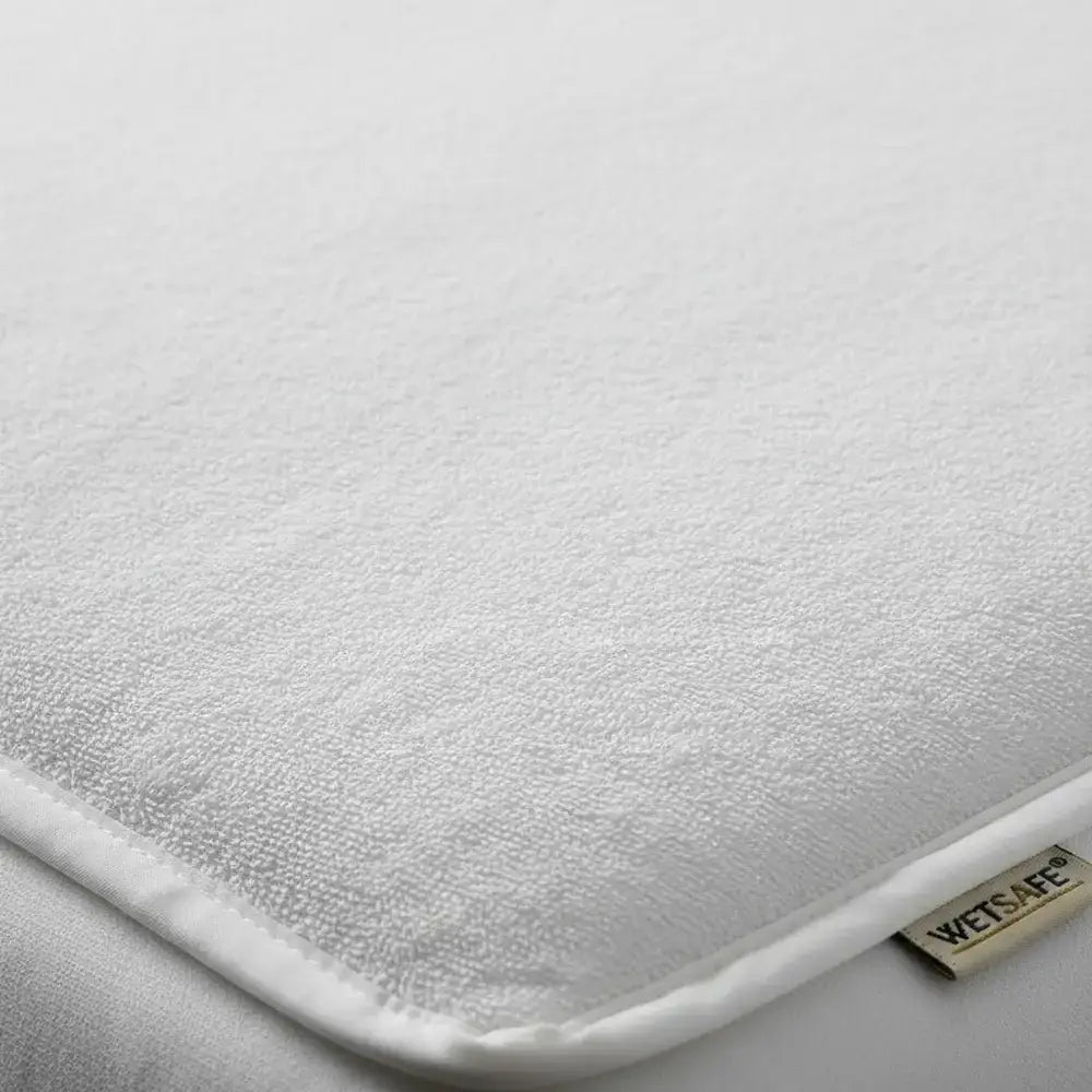 White towelling Wetsafe mattress protector with terry texture and brand label - Linen and Co