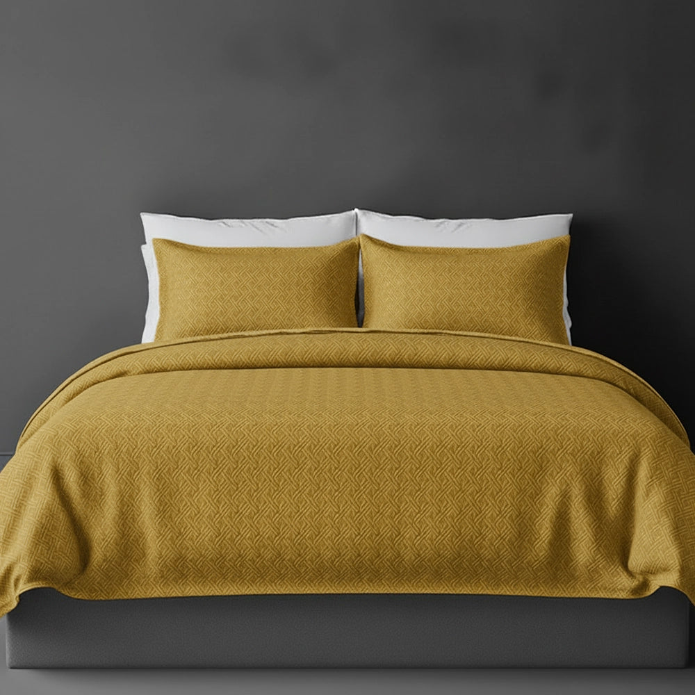 Mustard Rome bedspread on bed by Linen and Co - luxury hospitality bedspread with textured finish