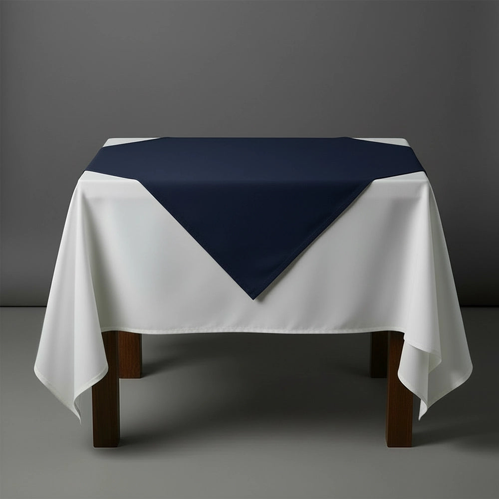 Navy Blue overlay on a white table cloth by Linen and Co - premium hospitality 