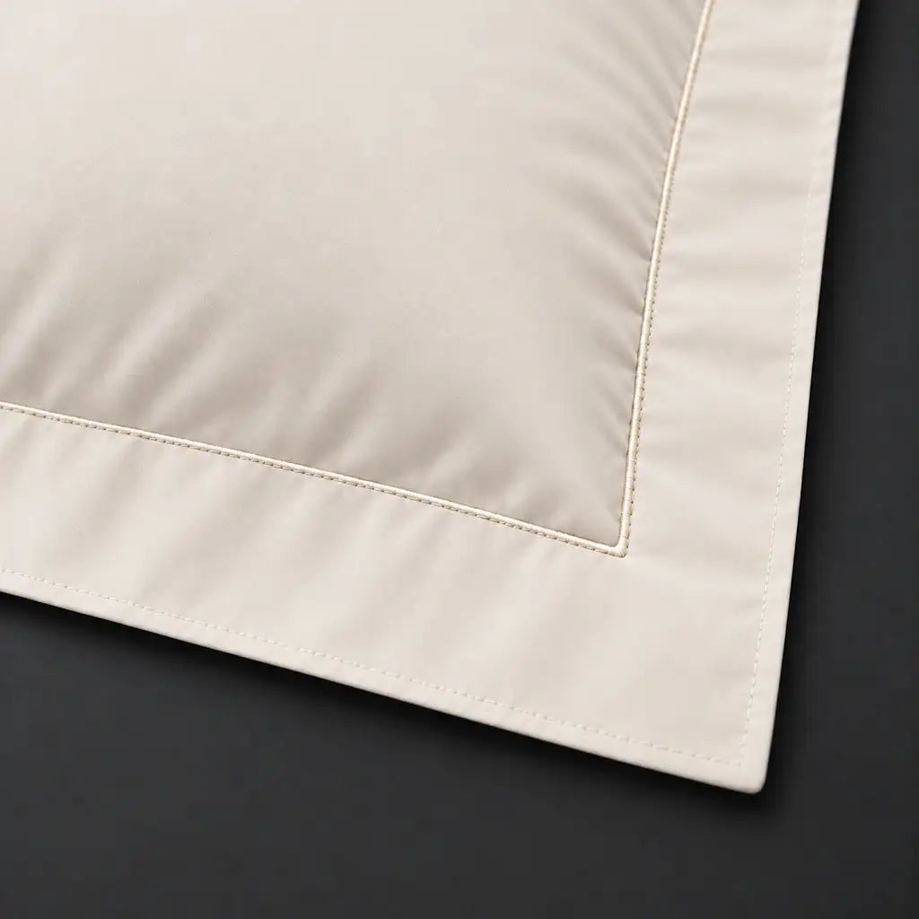 Close-up of cream Oxford pillowcase with one row cream satin stitch border by Linen and Co