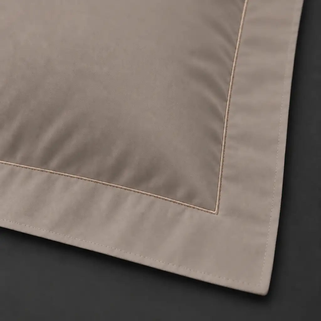 Close-up of stone Oxford pillowcase with one row stone satin stitch border by Linen and Co