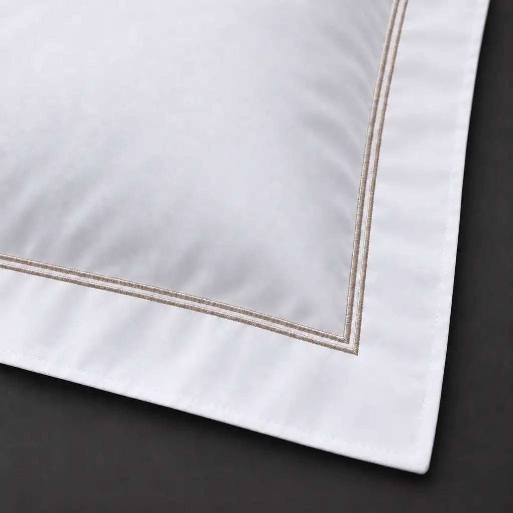 Close-up of white Oxford pillowcase with two row stone satin stitch border by Linen and Co