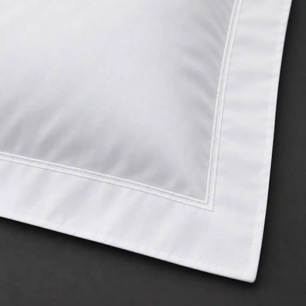 Close-up of white Oxford pillowcase with two row white satin stitch border by Linen and Co