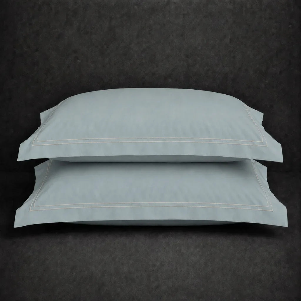 Duck Egg polycotton percale 200TC Oxford pillow case, Standard and King, natural cream two row satin stitch — stacked pair view.