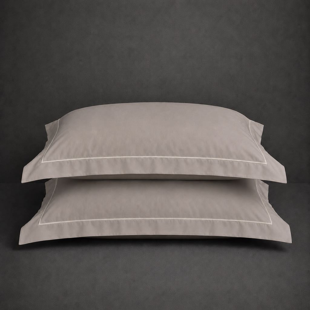 Stone polycotton percale 200TC Oxford pillow case, Standard and King, natural cream one row satin stitch — stacked pair view.