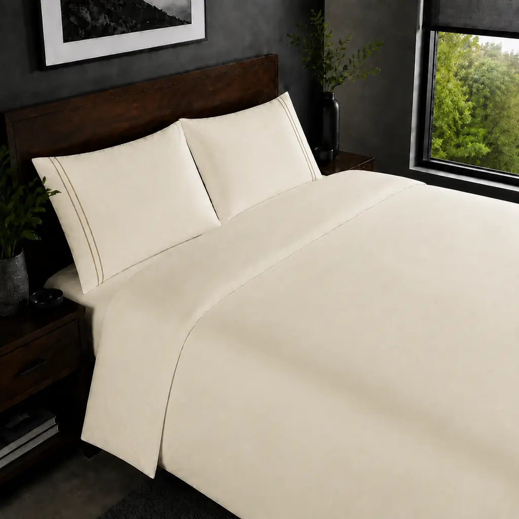 Cream 200TC plain duvet cover with Stone two row satin stitch - on the bed - Linen and Co