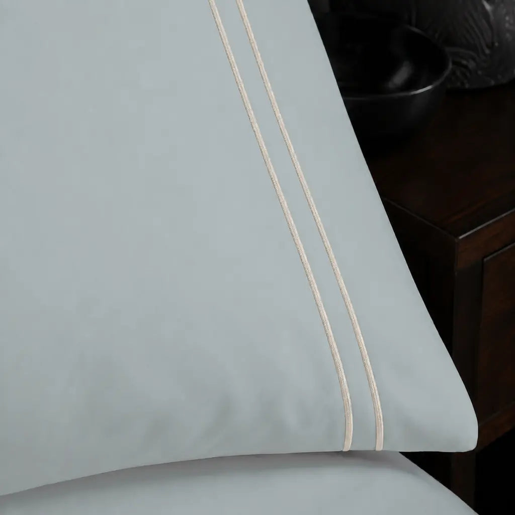 Close-up of cream two-row satin stitch on the Duck Egg Polycotton Percale 200TC duvet cover set.