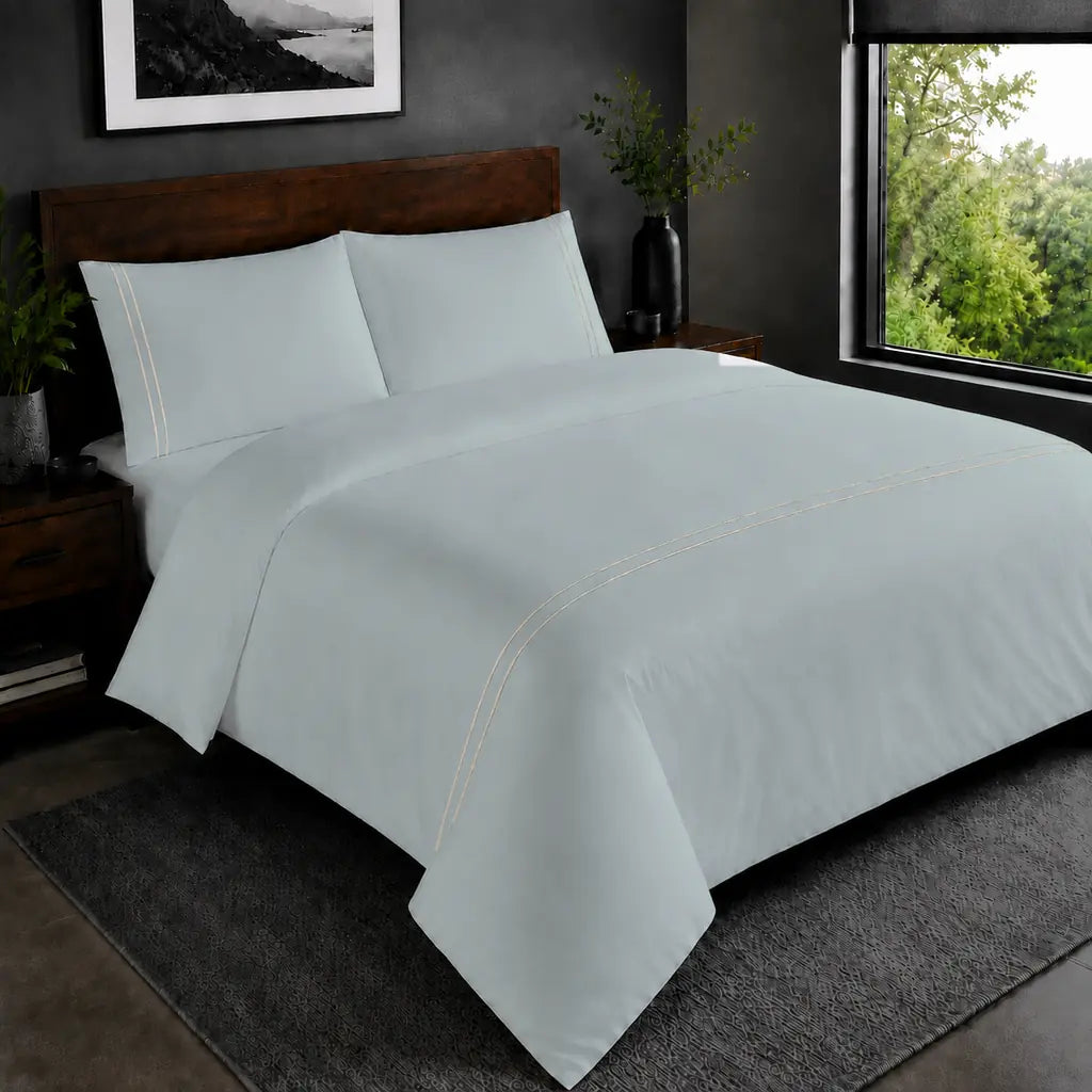 Duck Egg Polycotton Percale 200TC duvet cover set with cream two-row satin stitch in the hero bedroom view.