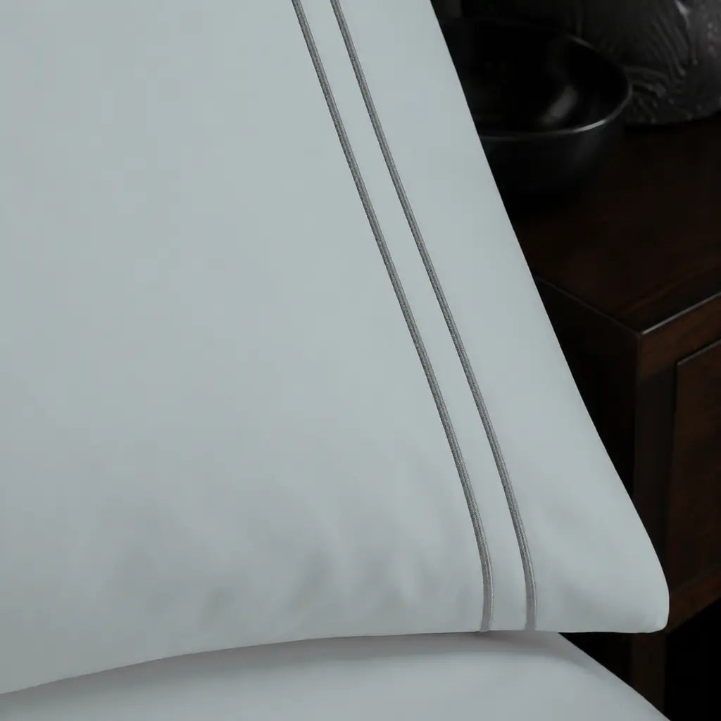 Close-up of grey two-row satin stitch on the Duck Egg Polycotton Percale 200TC duvet cover set.