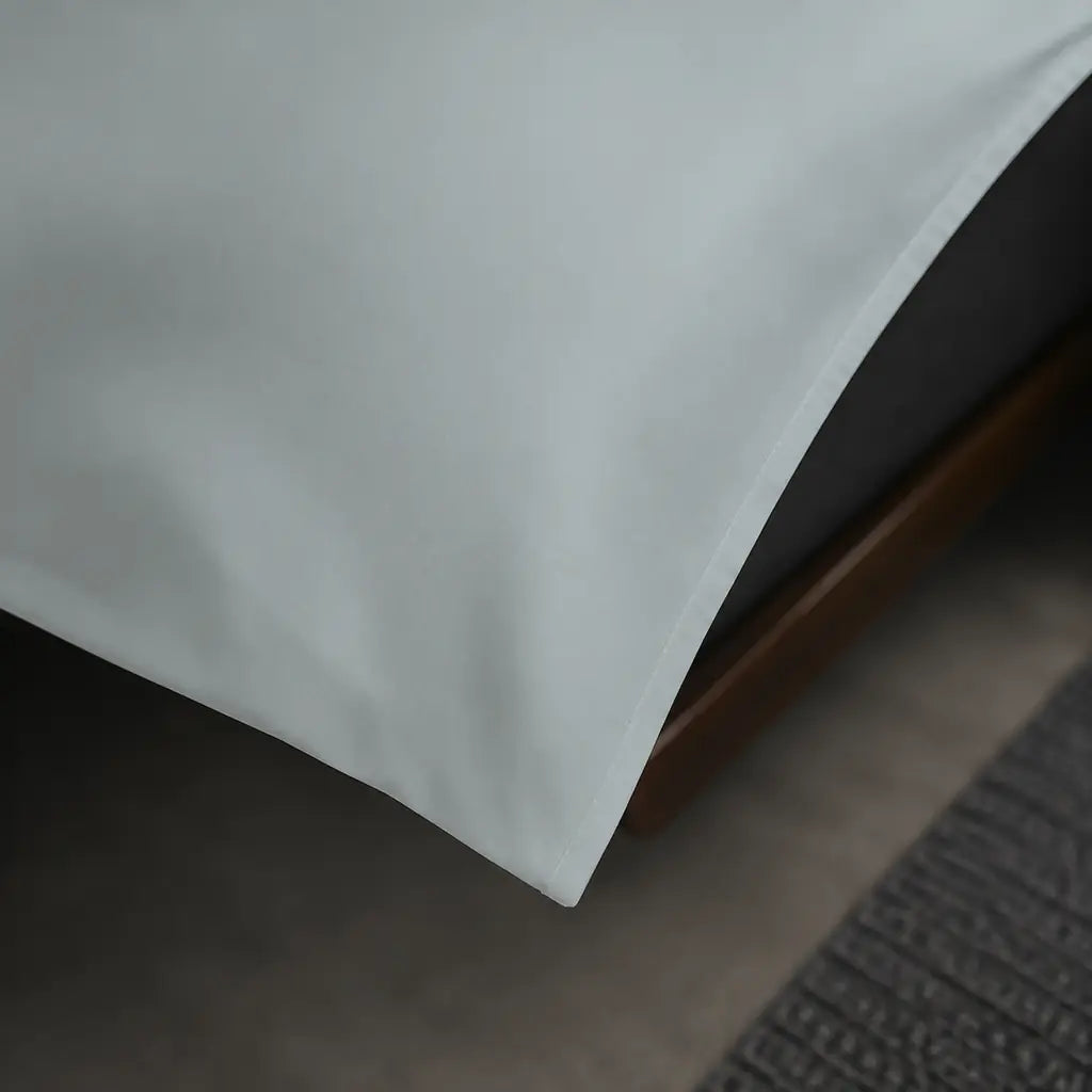 Close-up of the plain border and fabric on the Duck Egg Polycotton Percale 200TC duvet cover set.