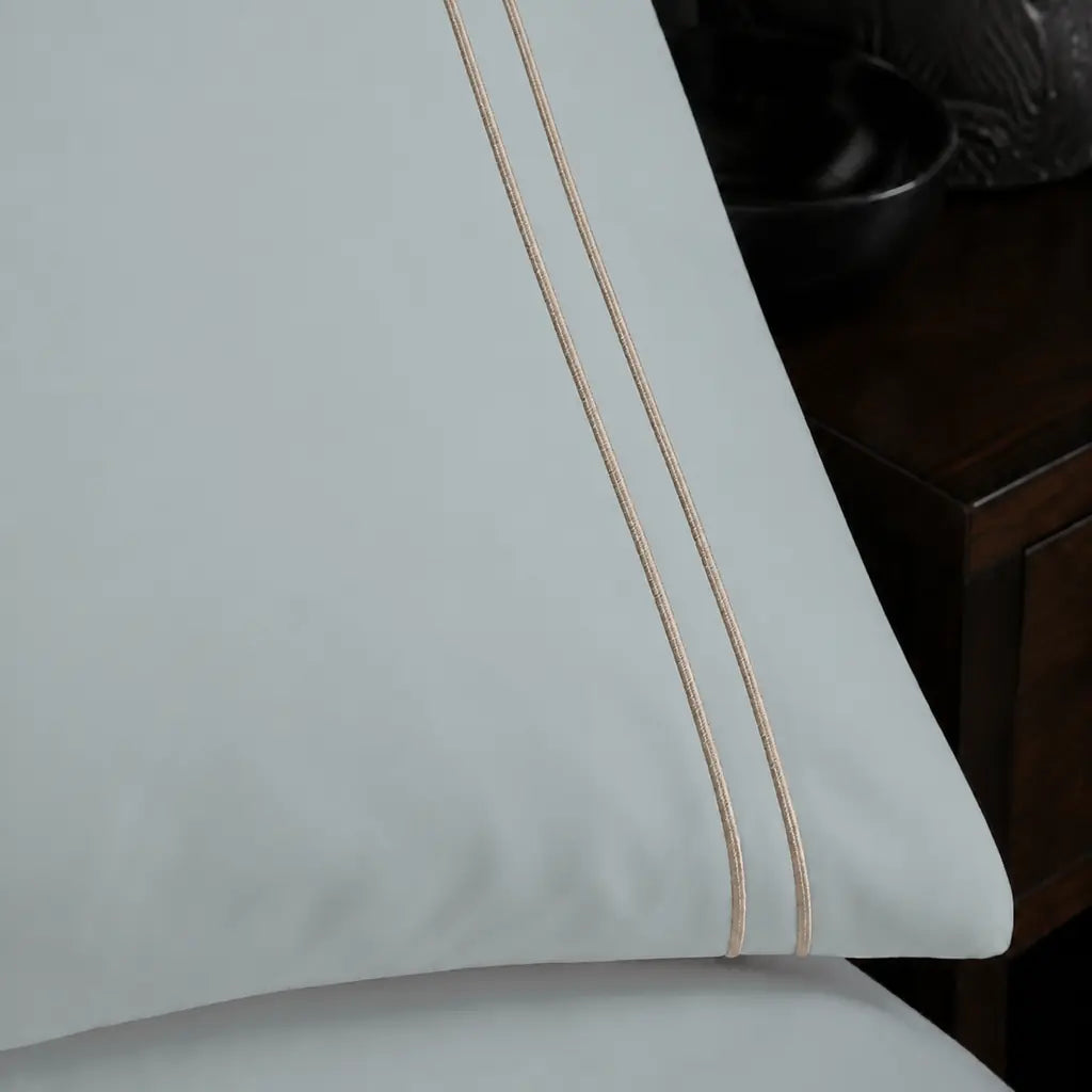 Close-up of stone two-row satin stitch on the Duck Egg Polycotton Percale 200TC duvet cover set.